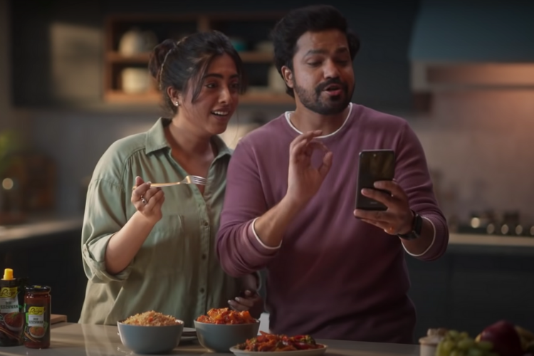 A lady stirs the pot with Mother's Recipe, plates a dish of spicy family drama