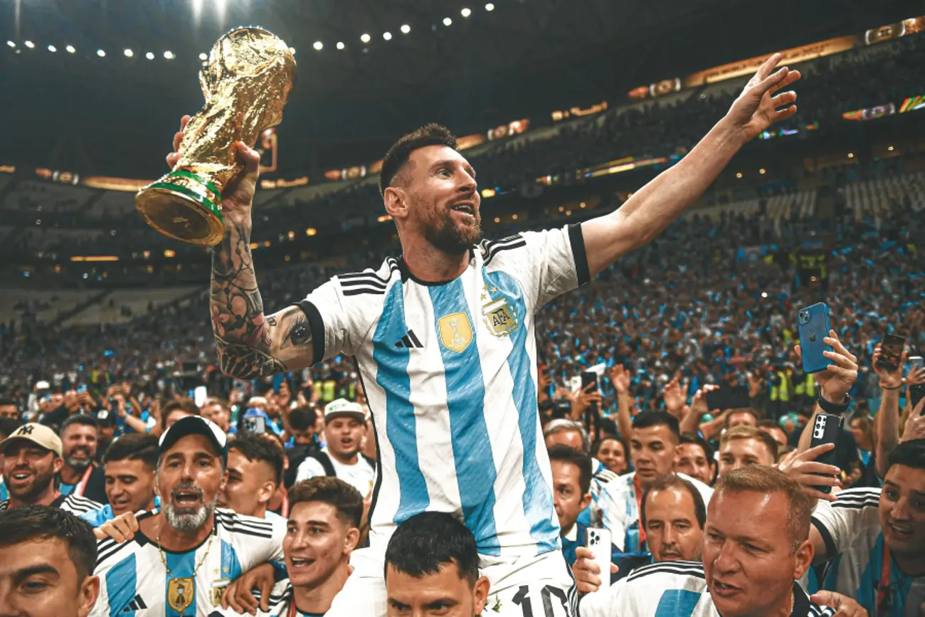 Lionel Messi with the 2022 FIFA World Cup trophy in Qatar. 